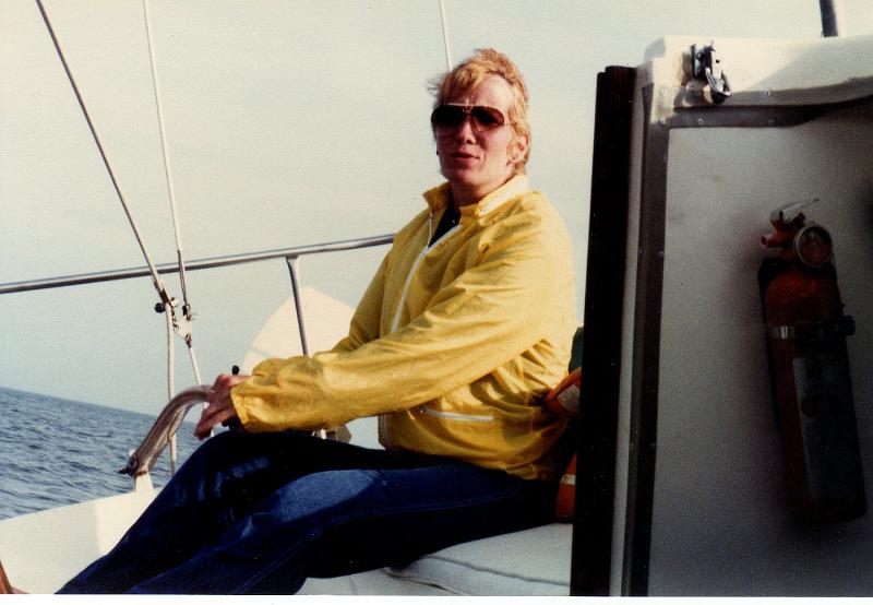 EveningStarOday23_018.jpg - Debbie on the tiller